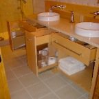 Double sink, maple vanity storage open